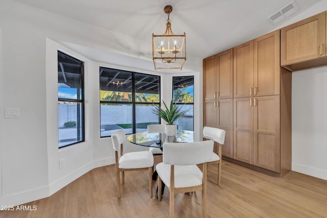 1001 N Nielson St, Gilbert, AZ 85234 - dining area with a chandelier, baseboards, and light wood-type flooring