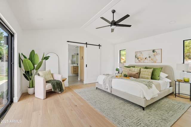 bedroom featuring access to outside, ceiling fan, a barn door, vaulted ceiling with beams, and light hardwood / wood-style floors