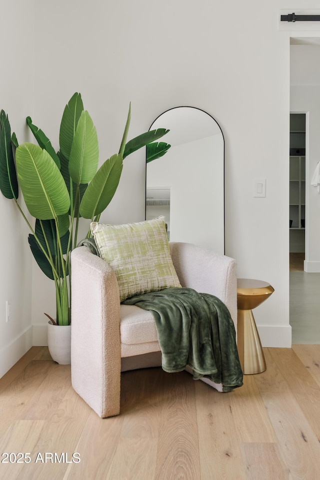 sitting room featuring wood-type flooring