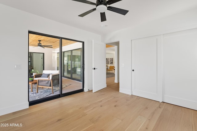 spare room featuring light hardwood / wood-style flooring and ceiling fan