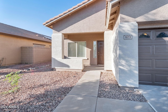 property entrance with a garage