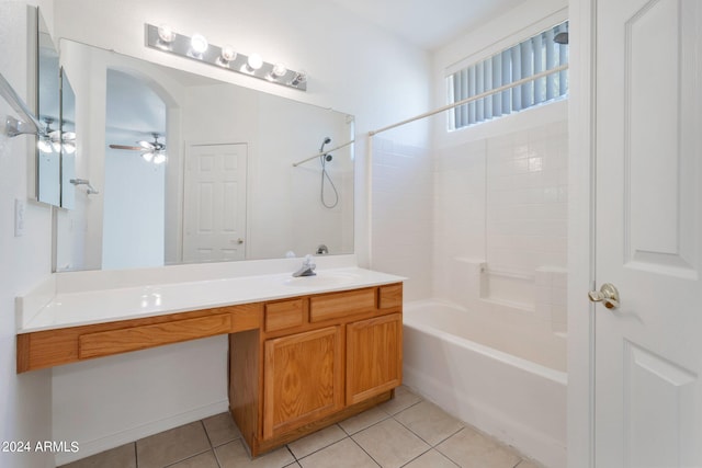 bathroom with tile patterned floors, ceiling fan, vanity, and shower / washtub combination