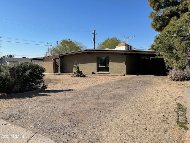 exterior space with a carport