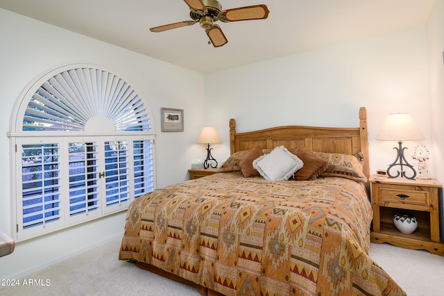 bedroom with light carpet and ceiling fan