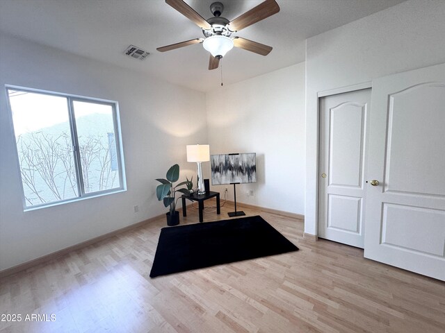 office featuring wood finished floors, visible vents, and baseboards