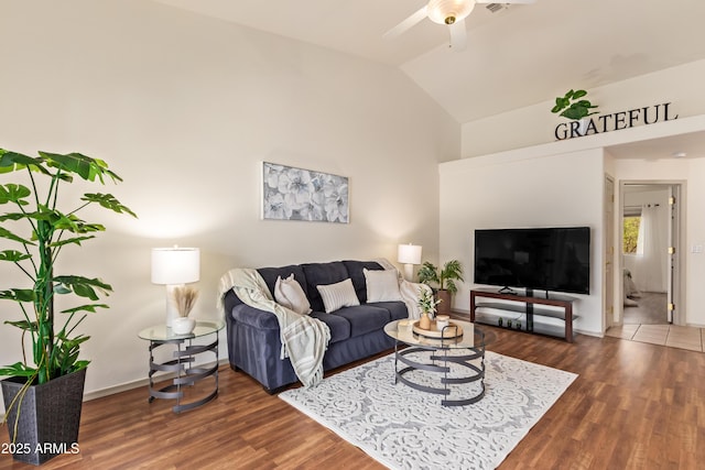 living room with wood finished floors, ceiling fan, high vaulted ceiling, and baseboards
