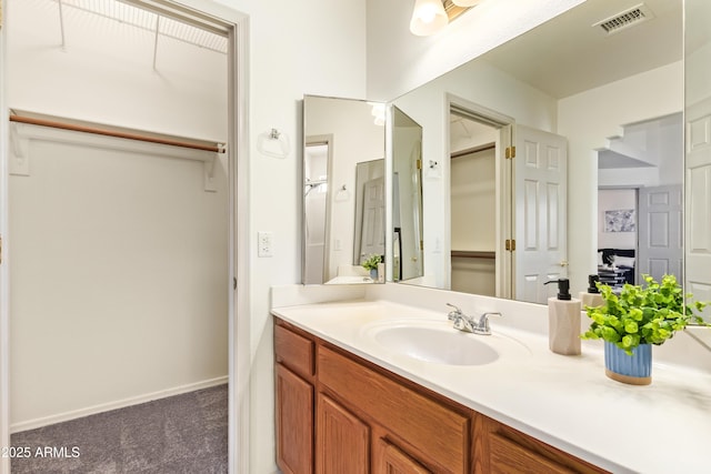 bathroom featuring vanity and baseboards