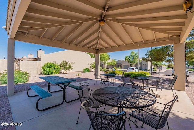 view of patio featuring outdoor dining area
