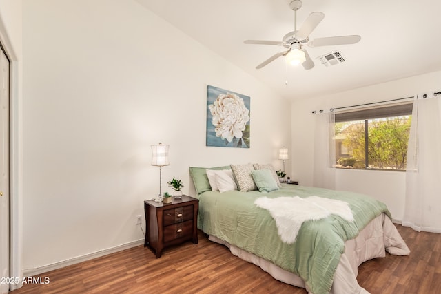 bedroom with lofted ceiling, wood finished floors, baseboards, and ceiling fan