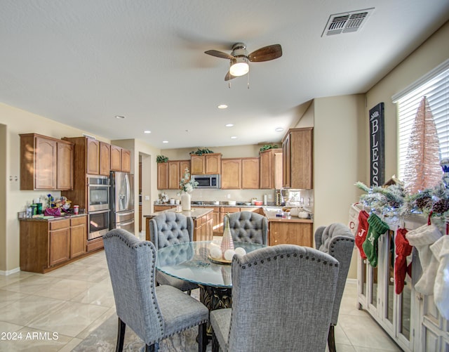 dining space featuring ceiling fan