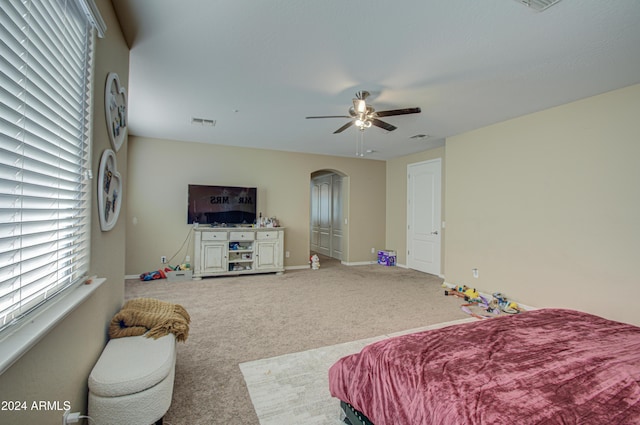 carpeted bedroom featuring ceiling fan