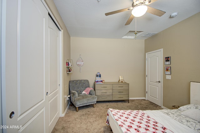 bedroom featuring light carpet, a closet, and ceiling fan