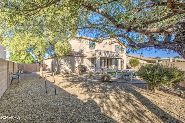 back of property with a patio area