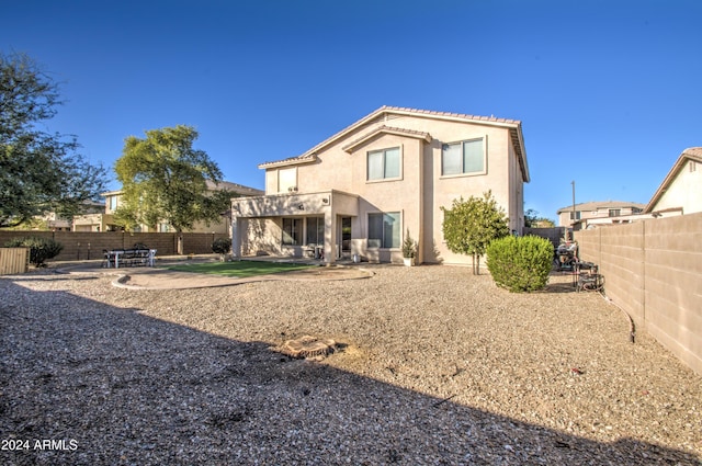 back of property with a patio area