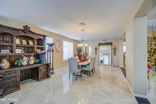 dining area with a chandelier