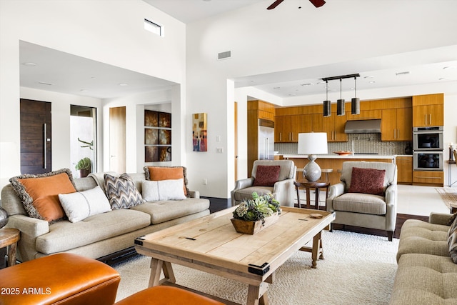 9894 E Miramonte Dr, Scottsdale, AZ 85262 - living room featuring a ceiling fan and a high ceiling