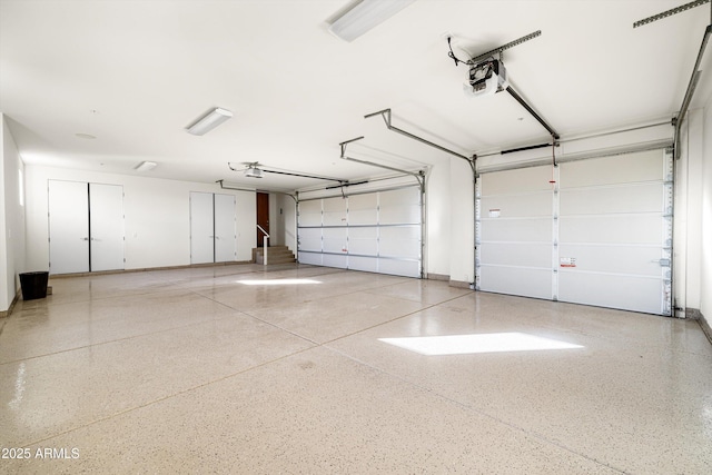 9894 E Miramonte Dr, Scottsdale, AZ 85262 - garage with a garage door opener and baseboards