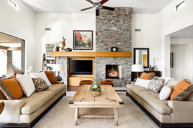 9894 E Miramonte Dr, Scottsdale, AZ 85262 - living area featuring a ceiling fan, a fireplace, and wood finished floors