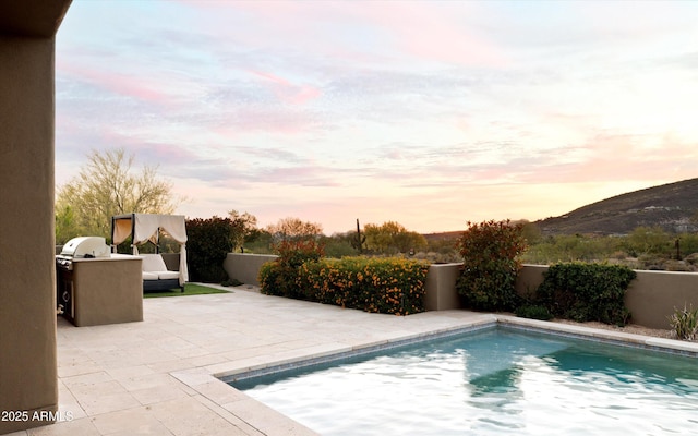 9894 E Miramonte Dr, Scottsdale, AZ 85262 - view of pool featuring a patio area, a mountain view, and a fenced backyard