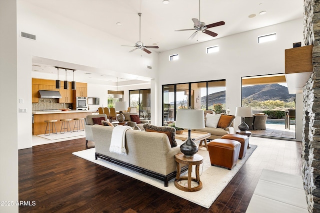 9894 E Miramonte Dr, Scottsdale, AZ 85262 - living room with a high ceiling, ceiling fan, hardwood / wood-style flooring, recessed lighting, and a mountain view