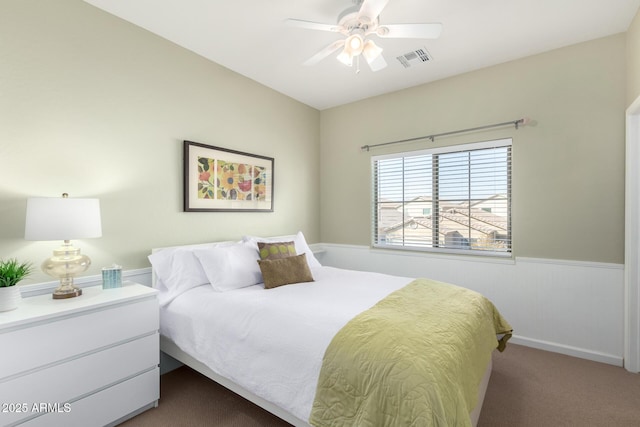 bedroom featuring ceiling fan and dark colored carpet