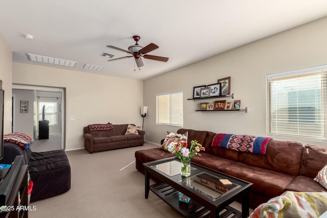 carpeted living room featuring ceiling fan