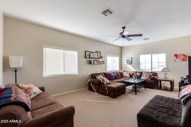 living room featuring ceiling fan and light colored carpet