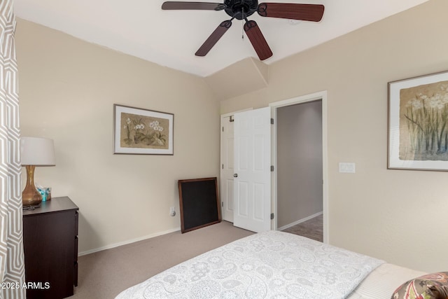 carpeted bedroom featuring vaulted ceiling and ceiling fan