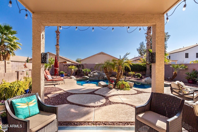 view of patio / terrace with a fenced in pool