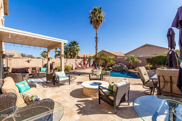 view of patio featuring an outdoor living space with a fire pit