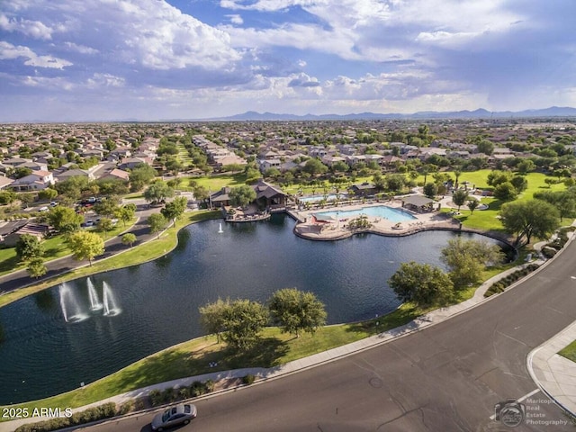 birds eye view of property featuring a water and mountain view