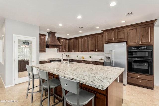 26719 S 195th St, Queen Creek, AZ 85142 - kitchen featuring light stone countertops, dark brown cabinetry, a sink, stainless steel appliances, and custom range hood