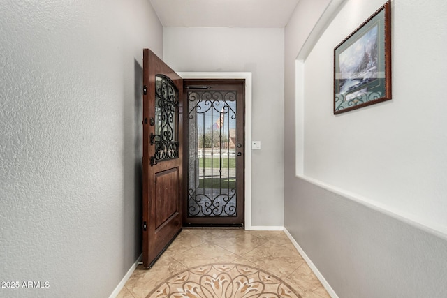 26719 S 195th St, Queen Creek, AZ 85142 - doorway to outside featuring light tile patterned floors and baseboards