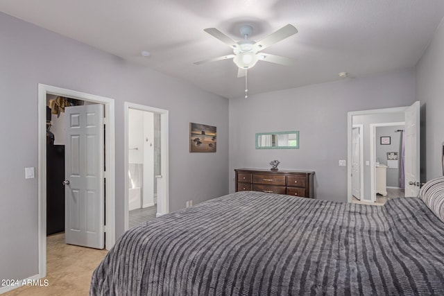 bedroom with ensuite bath and ceiling fan