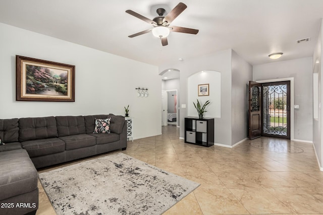 26719 S 195th St, Queen Creek, AZ 85142 - living area with arched walkways, visible vents, baseboards, and a ceiling fan
