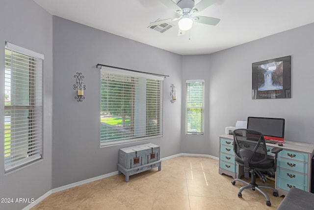 office space featuring ceiling fan and light tile patterned flooring