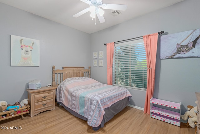 bedroom with ceiling fan and light wood-type flooring