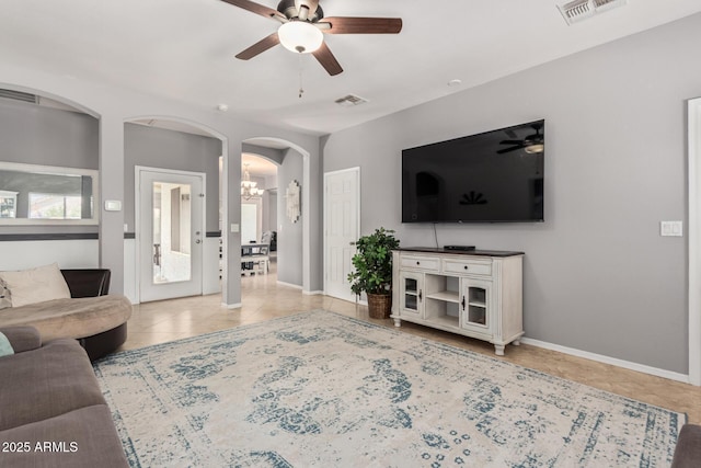 26719 S 195th St, Queen Creek, AZ 85142 - living area with visible vents, tile patterned floors, arched walkways, and ceiling fan with notable chandelier