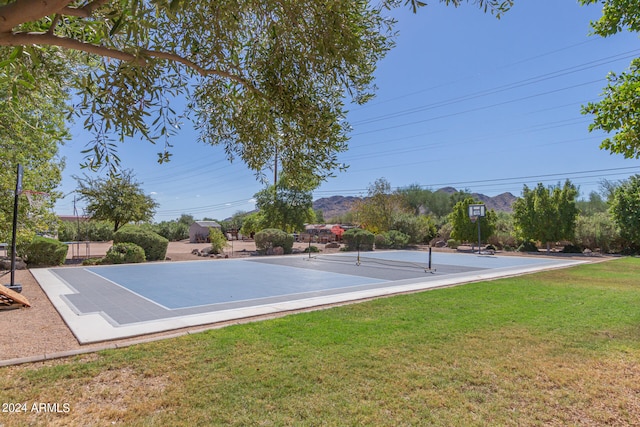 view of sport court featuring a yard and tennis court