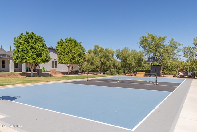 view of tennis court featuring basketball court