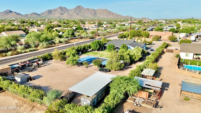 birds eye view of property with a mountain view