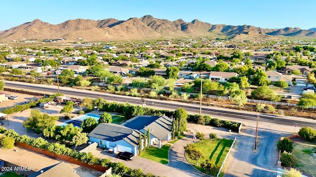 birds eye view of property featuring a mountain view