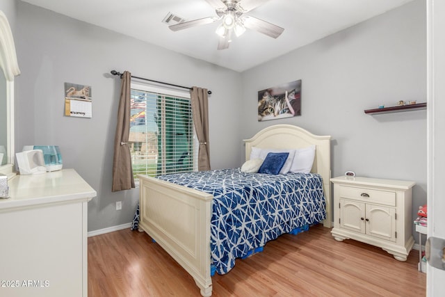 bedroom featuring ceiling fan and light hardwood / wood-style floors