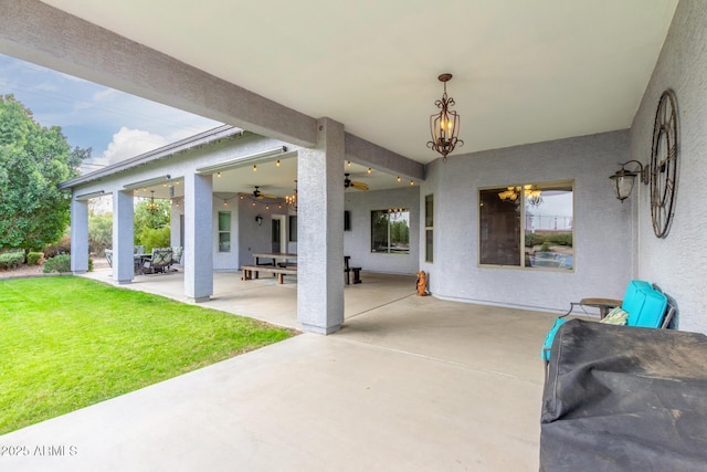 view of patio with ceiling fan