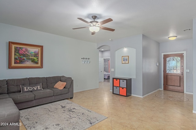 living room with light tile patterned floors and ceiling fan