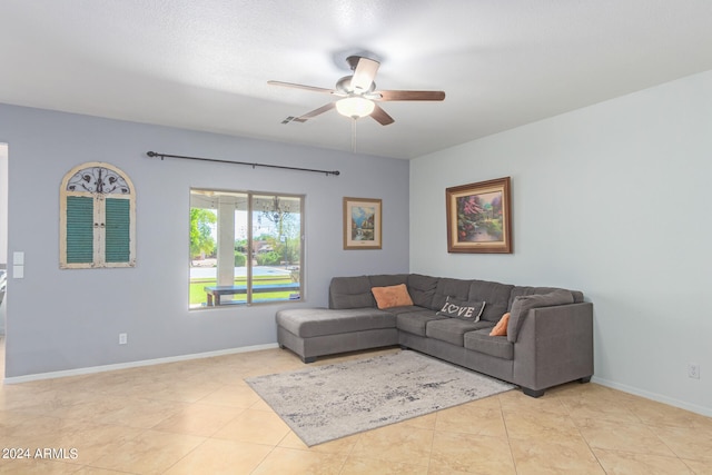 tiled living room featuring ceiling fan