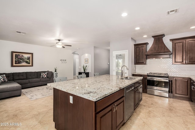 26719 S 195th St, Queen Creek, AZ 85142 - kitchen with custom exhaust hood, visible vents, arched walkways, a sink, and stainless steel appliances