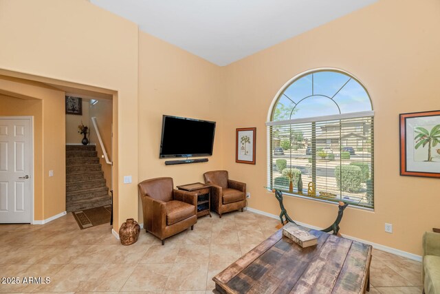 3932 E Melinda Dr, Phoenix, AZ 85050 - sitting room with light tile patterned floors, stairway, and baseboards