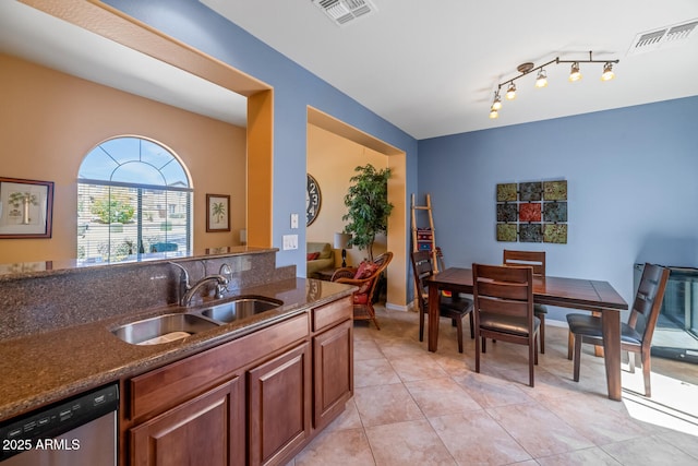 3932 E Melinda Dr, Phoenix, AZ 85050 - kitchen with dark stone countertops, visible vents, stainless steel dishwasher, and a sink