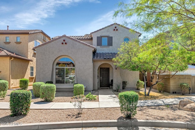 3932 E Melinda Dr, Phoenix, AZ 85050 - mediterranean / spanish home featuring stucco siding, fence, and a tiled roof
